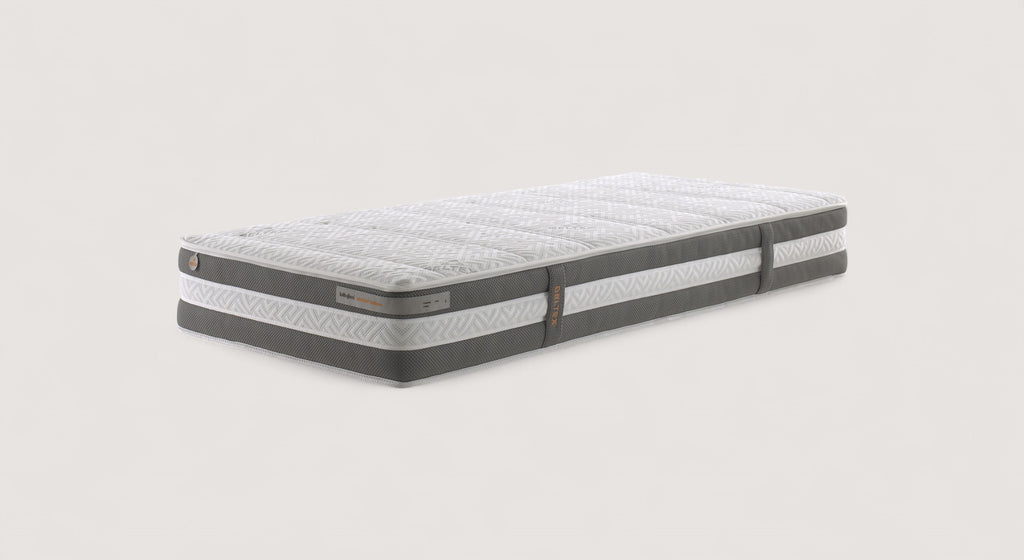 Matelas Geltex Wellness 2 avec design ergonomique et motifs géométriques, sur fond neutre