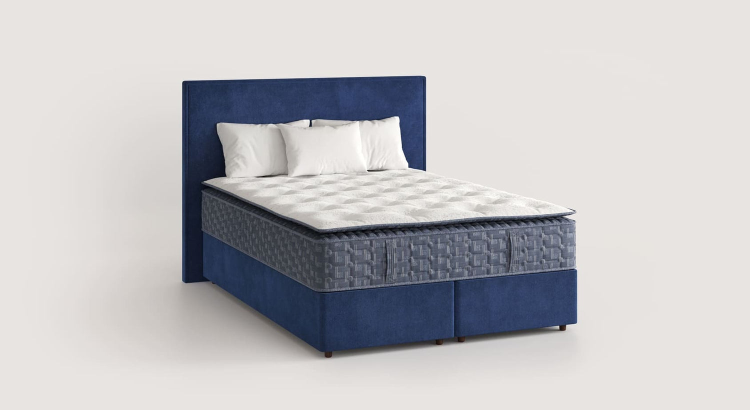 Matelas BRIGHTON Confort Ferme posé sur un lit coffre en tissu bleu avec une tête de lit assortie, offrant une literie haut de gamme pour un confort optimal.